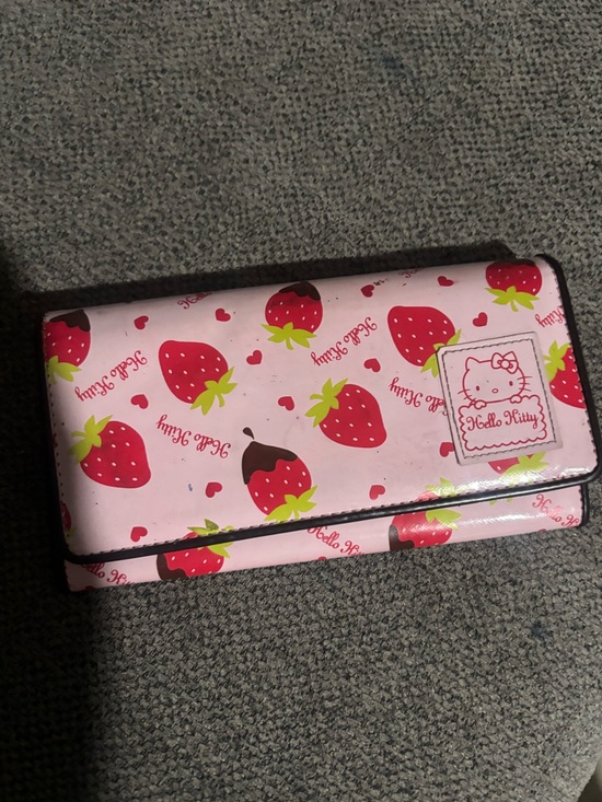 Hello Kitty Handbags - Hello kitty pink  long wallet with strawberries printed all over it. 🍓🐱